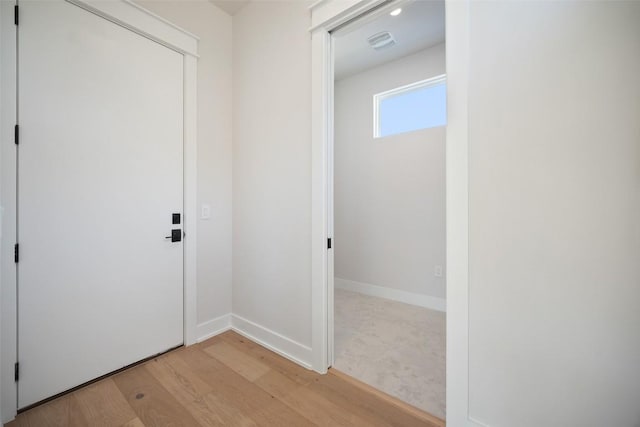 6301 Bristol Cir Unit 1, Austin, TX 78723 - corridor with light wood-type flooring and baseboards