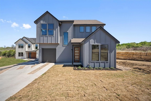 6301 Bristol Cir Unit 1, Austin, TX 78723 - contemporary home with board and batten siding, an attached garage, concrete driveway, a front yard, and roof with shingles