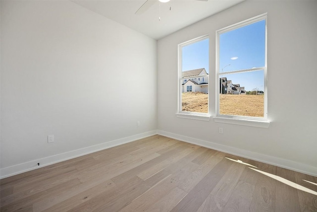 6301 Bristol Cir Unit 1, Austin, TX 78723 - spare room featuring light wood-style floors, a ceiling fan, healthy amount of natural light, and baseboards