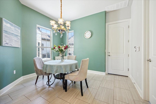 1600 Morning Moon Cir, Austin, TX 78732 - dining room featuring a chandelier and wood tiled floors