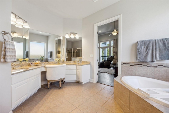 1600 Morning Moon Cir, Austin, TX 78732 - bathroom with a bath, double vanity, tile patterned flooring, and an enclosed shower