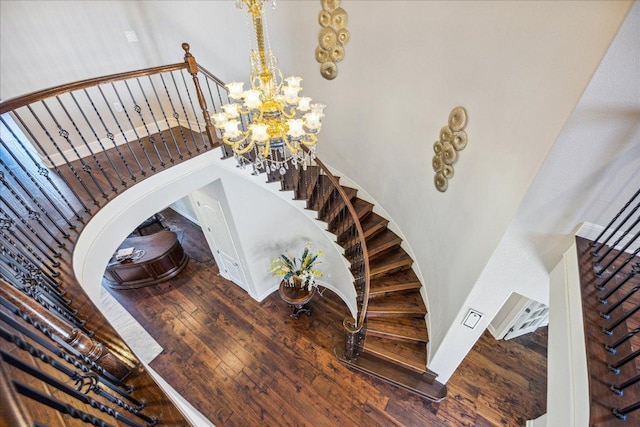 1600 Morning Moon Cir, Austin, TX 78732 - stairs featuring wood-type flooring and a chandelier