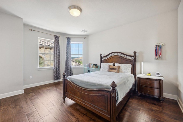 1600 Morning Moon Cir, Austin, TX 78732 - bedroom featuring baseboards and dark wood-type flooring