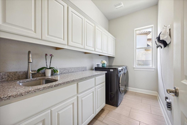 1600 Morning Moon Cir, Austin, TX 78732 - laundry area featuring washer and dryer and cabinet space
