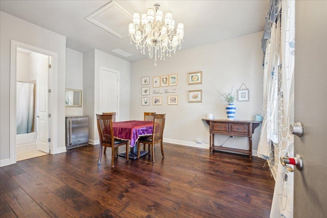 1600 Morning Moon Cir, Austin, TX 78732 - dining space with wood finished floors, a chandelier, and attic access