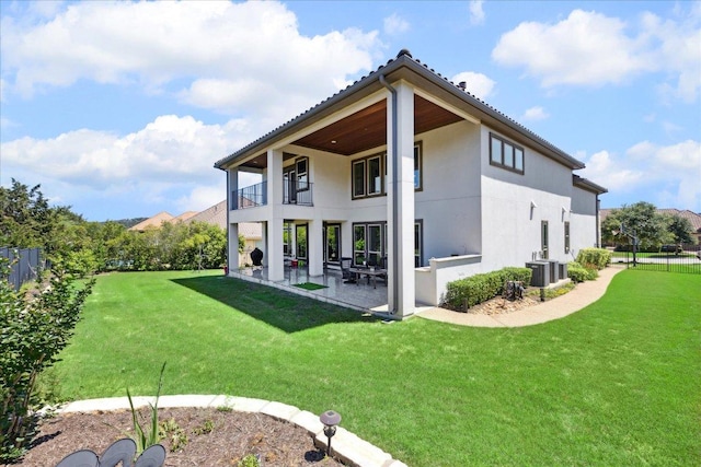 1600 Morning Moon Cir, Austin, TX 78732 - back of house with a balcony, a patio, stucco siding, and a tile roof