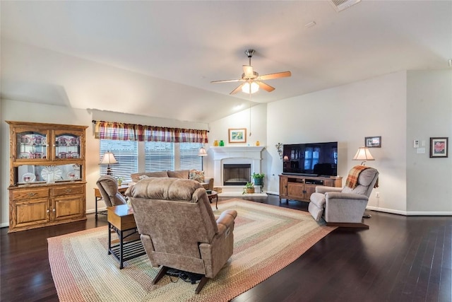 351 Still Hollow Crk, Buda, TX 78610 - living area with baseboards, dark wood-style flooring, a ceiling fan, a glass covered fireplace, and lofted ceiling