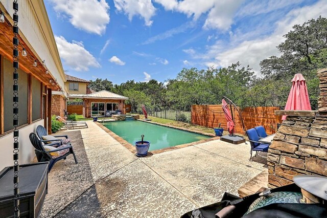 409 Hurst Creek Rd, Lakeway, TX 78734 - view of swimming pool featuring a patio, a fenced backyard, a pool with connected hot tub, and a gazebo