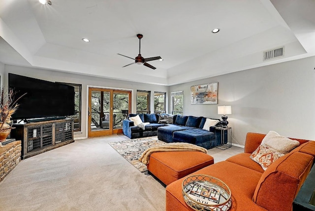 409 Hurst Creek Rd, Lakeway, TX 78734 - living area featuring a raised ceiling, light colored carpet, ceiling fan, and recessed lighting