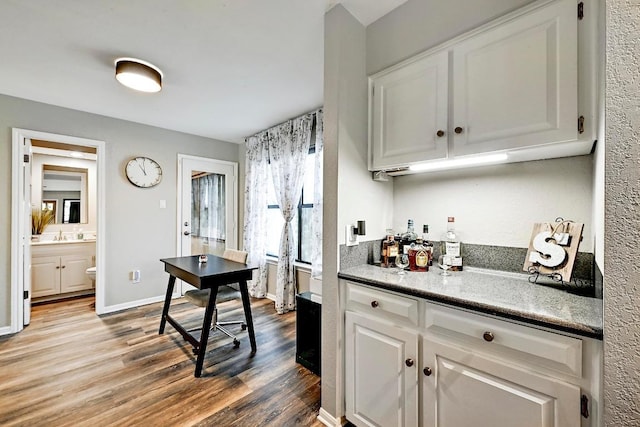 409 Hurst Creek Rd, Lakeway, TX 78734 - kitchen featuring wood finished floors and white cabinetry