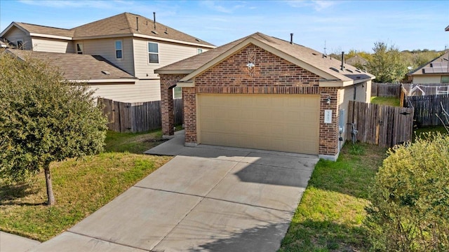 view of front of property with brick siding, a garage, concrete driveway, and fence