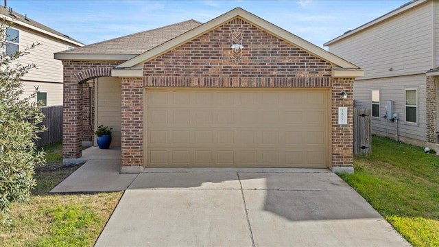 view of front of property with concrete driveway, an attached garage, and brick siding