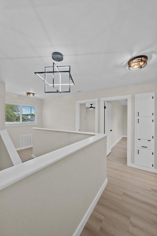 3005 Canter Ln, Austin, TX 78759 - hallway with baseboards and light wood finished floors