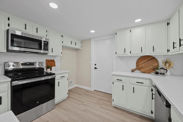 3005 Canter Ln, Austin, TX 78759 - kitchen featuring stainless steel appliances, light countertops, light wood finished floors, decorative backsplash, and recessed lighting