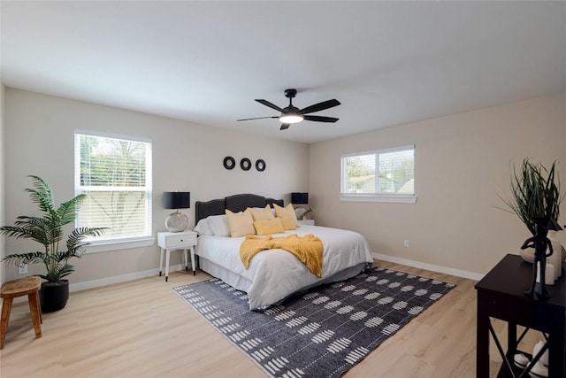 3005 Canter Ln, Austin, TX 78759 - bedroom with wood finished floors, baseboards, and ceiling fan