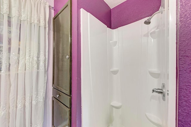 bathroom with a shower with shower curtain