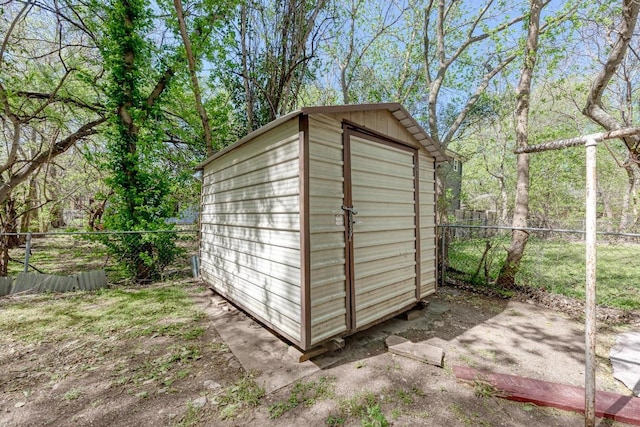 view of shed with a fenced backyard
