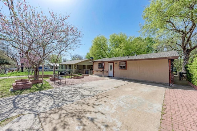 view of front of home with a patio area and fence