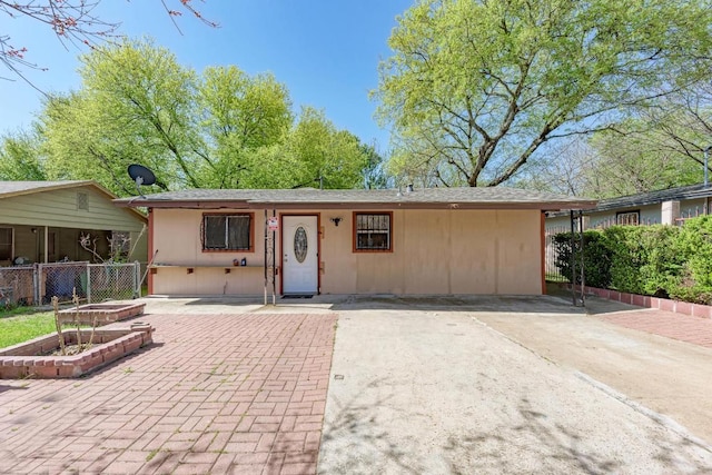 ranch-style house with a patio, a garden, and fence