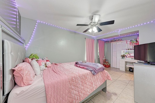 tiled bedroom with a ceiling fan