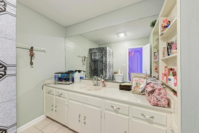 full bathroom with a stall shower, vanity, and tile patterned floors