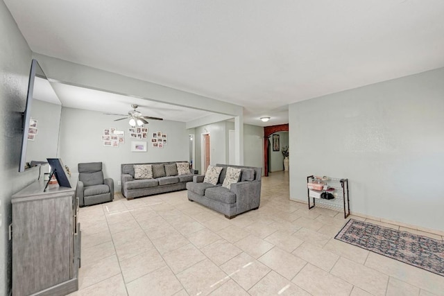 living room with ceiling fan and light tile patterned floors
