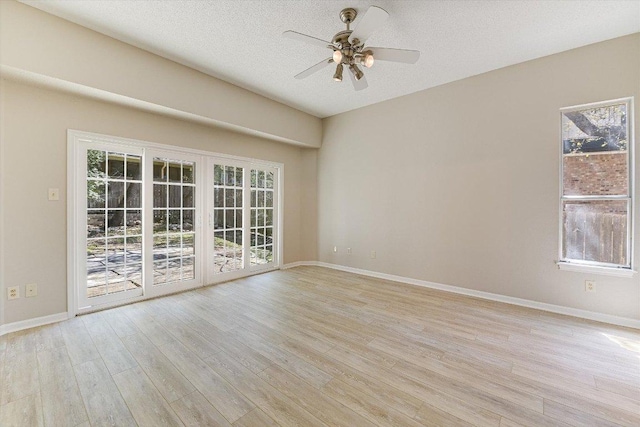 7304 Halbert Dr, Austin, TX 78750 - unfurnished room with plenty of natural light, light wood-type flooring, a ceiling fan, baseboards, and a textured ceiling