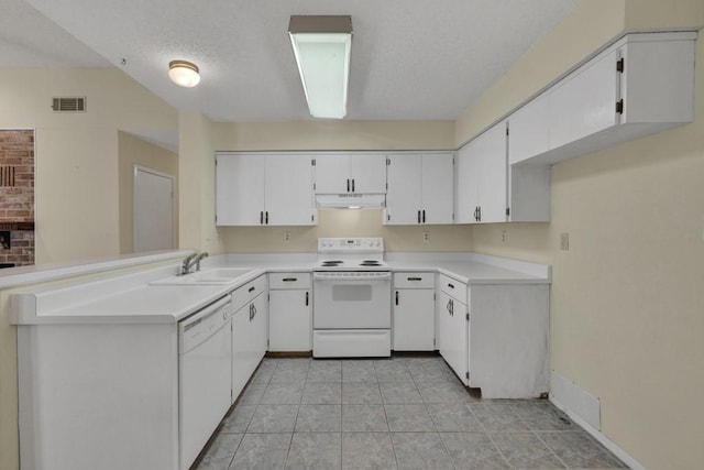36 Oak Villa Dr # C-2, Canyon Lake, TX 78133 - kitchen with under cabinet range hood, visible vents, a sink, and white appliances