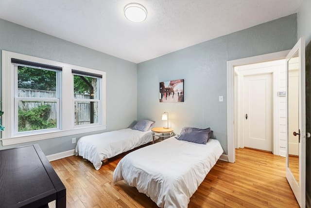 2310 Euclid Ave, Austin, TX 78704 - bedroom featuring light wood finished floors and baseboards
