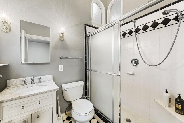 2310 Euclid Ave, Austin, TX 78704 - bathroom with a stall shower, vanity, and toilet