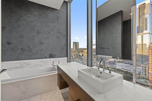 210 Lavaca St Unit 2312, Austin, TX 78701 - bathroom featuring a healthy amount of sunlight, vanity, a city view, and a bath
