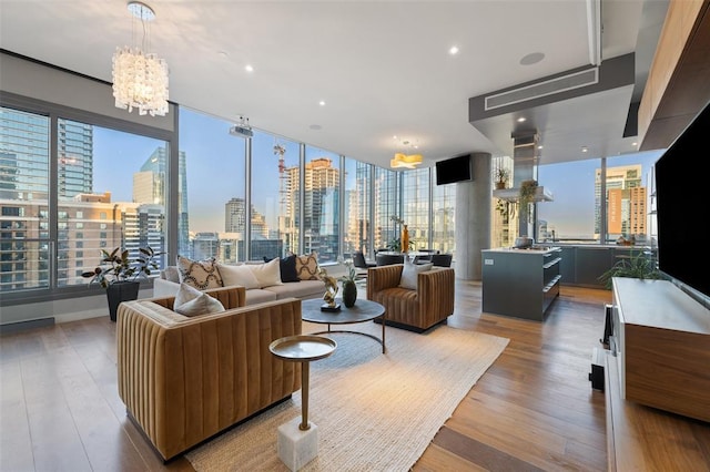 210 Lavaca St Unit 2312, Austin, TX 78701 - living room featuring light wood-style floors and a chandelier