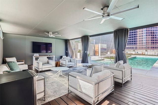 210 Lavaca St Unit 2312, Austin, TX 78701 - living room featuring a ceiling fan and dark wood-style floors
