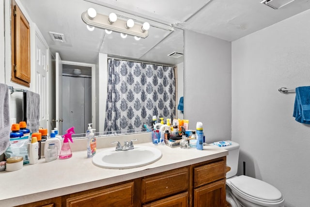 2110 Rio Grande St Unit 207, Austin, TX 78705 - bathroom with vanity, toilet, and a shower with shower curtain