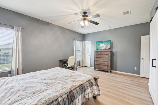 211 Almquist St, Hutto, TX 78634 - bedroom featuring light wood-style flooring and ceiling fan