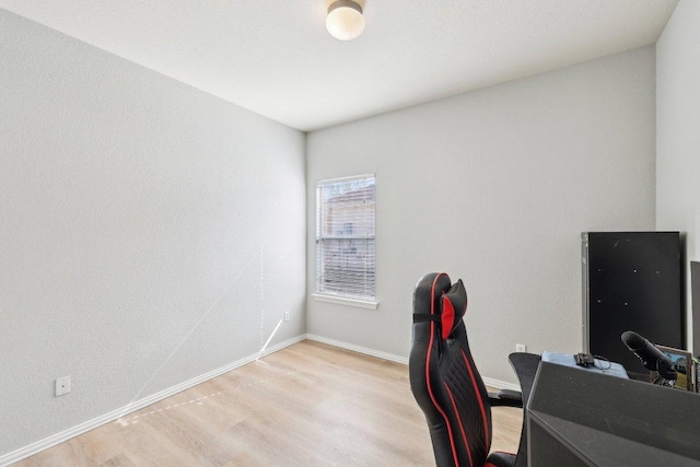 211 Almquist St, Hutto, TX 78634 - home office featuring light wood-style floors and baseboards