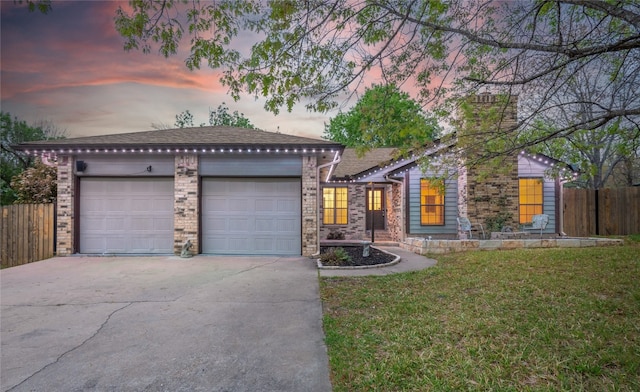100 Stubblefield Dr, Elgin, TX 78621 - view of front of house featuring concrete driveway, a garage, and a chimney