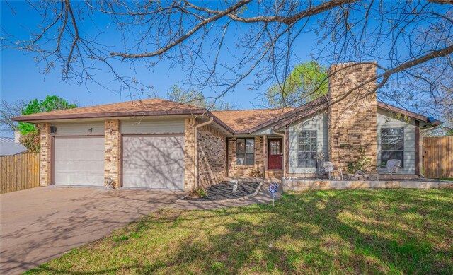 100 Stubblefield Dr, Elgin, TX 78621 - view of front of house featuring concrete driveway, an attached garage, brick siding, and a chimney