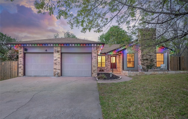 100 Stubblefield Dr, Elgin, TX 78621 - ranch-style house featuring concrete driveway, a garage, brick siding, and a chimney