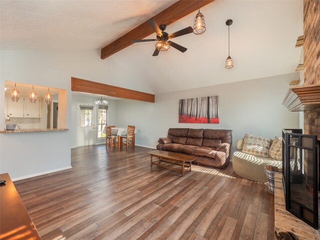 100 Stubblefield Dr, Elgin, TX 78621 - living area with ceiling fan, wood finished floors, and a fireplace