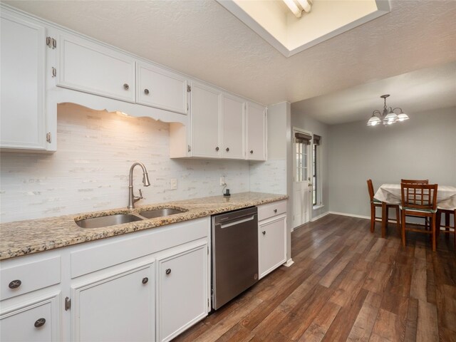 100 Stubblefield Dr, Elgin, TX 78621 - kitchen with dishwasher, backsplash, white cabinets, and dark wood finished floors