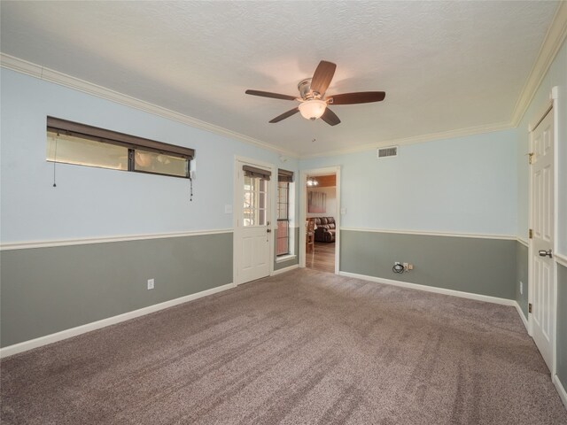 100 Stubblefield Dr, Elgin, TX 78621 - unfurnished bedroom with crown molding, carpet flooring, and a ceiling fan
