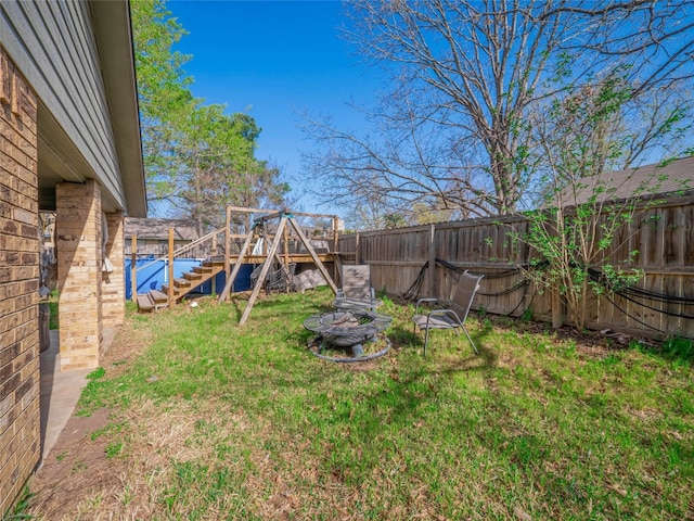 100 Stubblefield Dr, Elgin, TX 78621 - fenced backyard featuring stairs and a wooden deck