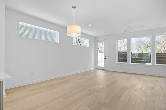 2209 Mcfly Pl, Austin, TX 78723 - spare room featuring light wood-type flooring, baseboards, a ceiling fan, and recessed lighting