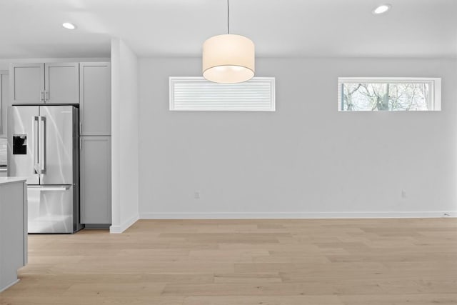 2209 Mcfly Pl, Austin, TX 78723 - unfurnished dining area featuring healthy amount of natural light, light wood finished floors, recessed lighting, and baseboards