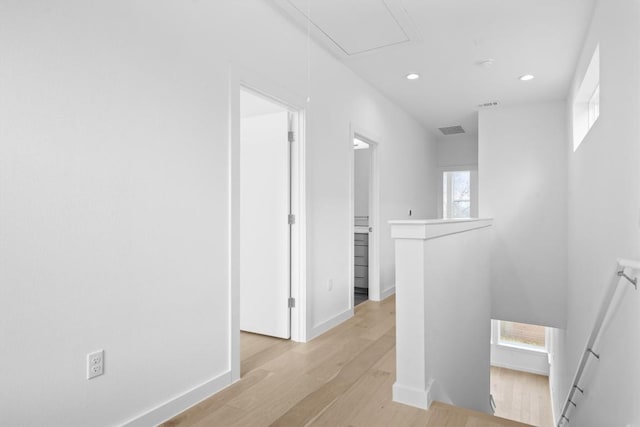 2209 Mcfly Pl, Austin, TX 78723 - hall with an upstairs landing, attic access, light wood-style flooring, and recessed lighting