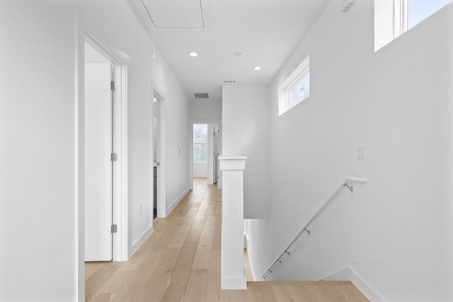 2209 Mcfly Pl, Austin, TX 78723 - corridor featuring an upstairs landing, attic access, light wood-style floors, recessed lighting, and baseboards