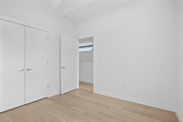 2209 Mcfly Pl, Austin, TX 78723 - unfurnished bedroom with light wood-style floors, a closet, and ceiling fan