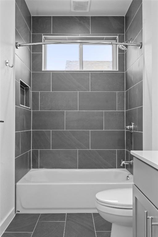 2209 Mcfly Pl, Austin, TX 78723 - full bathroom featuring vanity, plenty of natural light, and shower / bathtub combination