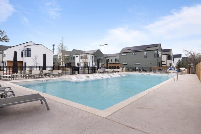 2209 Mcfly Pl, Austin, TX 78723 - community pool featuring a residential view and a patio